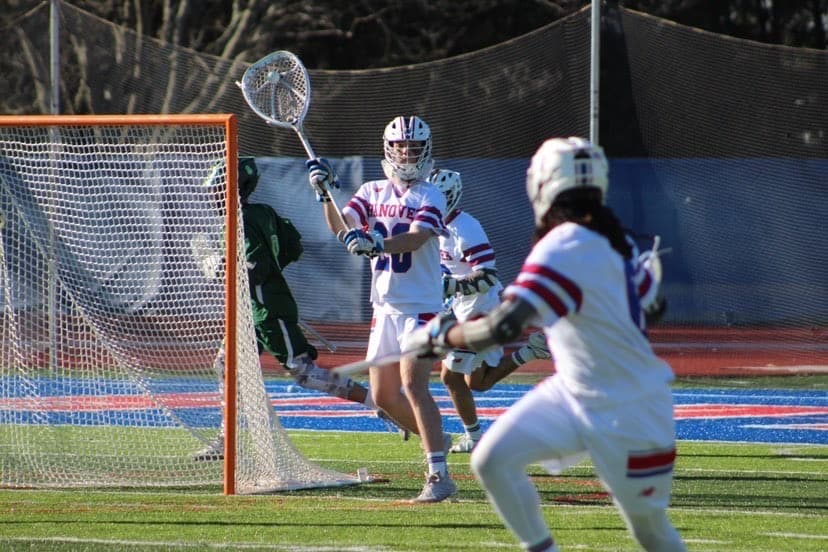Lacrosse goalie preparing an outlet pass after a save